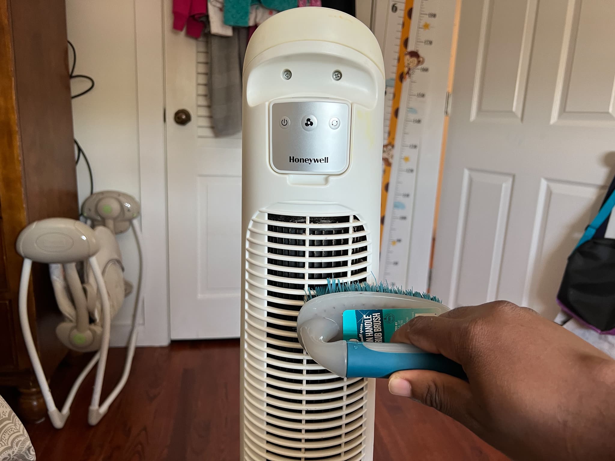 quietset honeywell tower fan being clean with a scrub brush