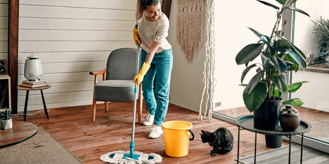 woman cleaning floor with mop