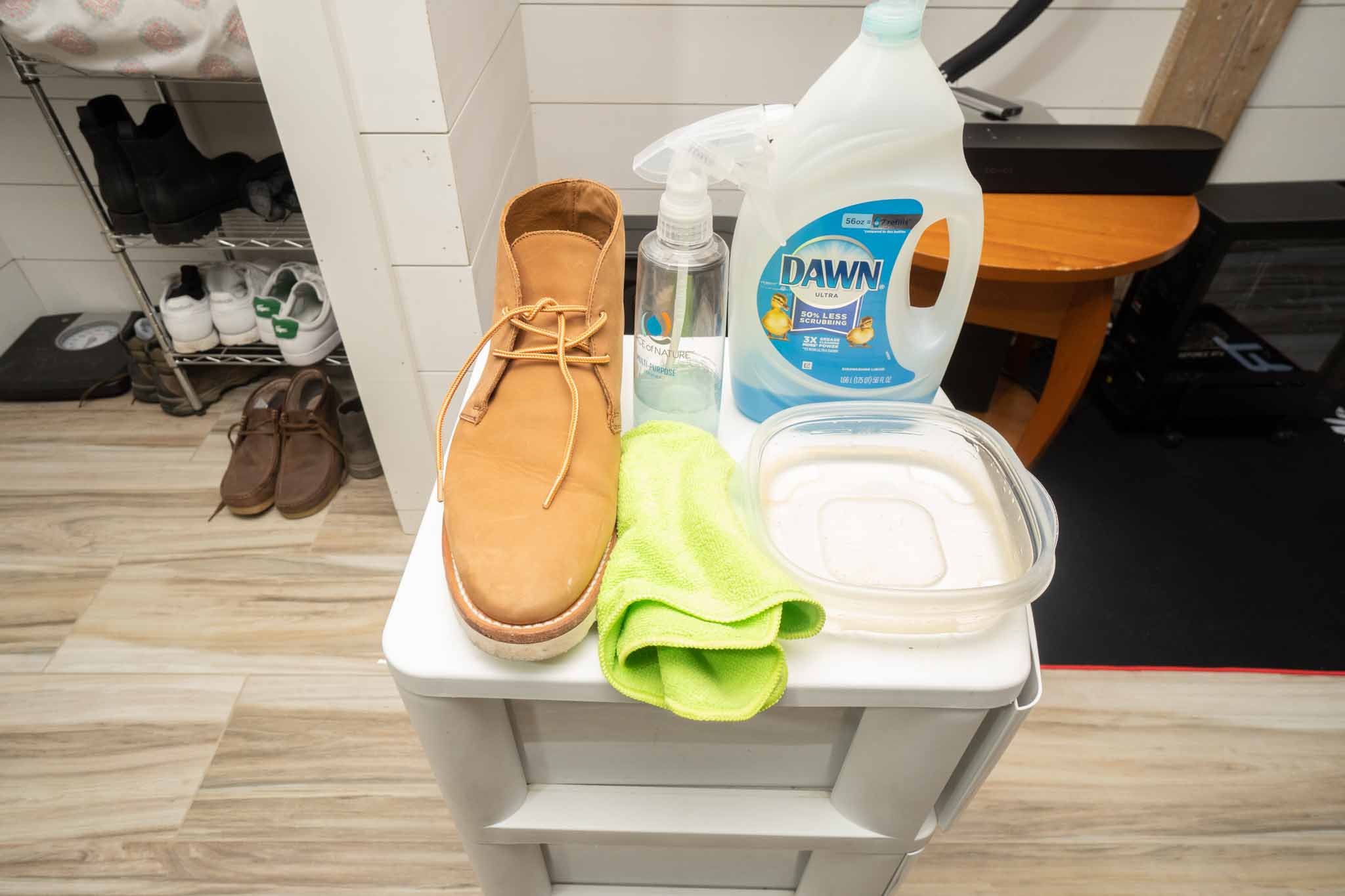 leather boot, microfiber cloth, warm water in bowl, dawn dish soap, spray bottle