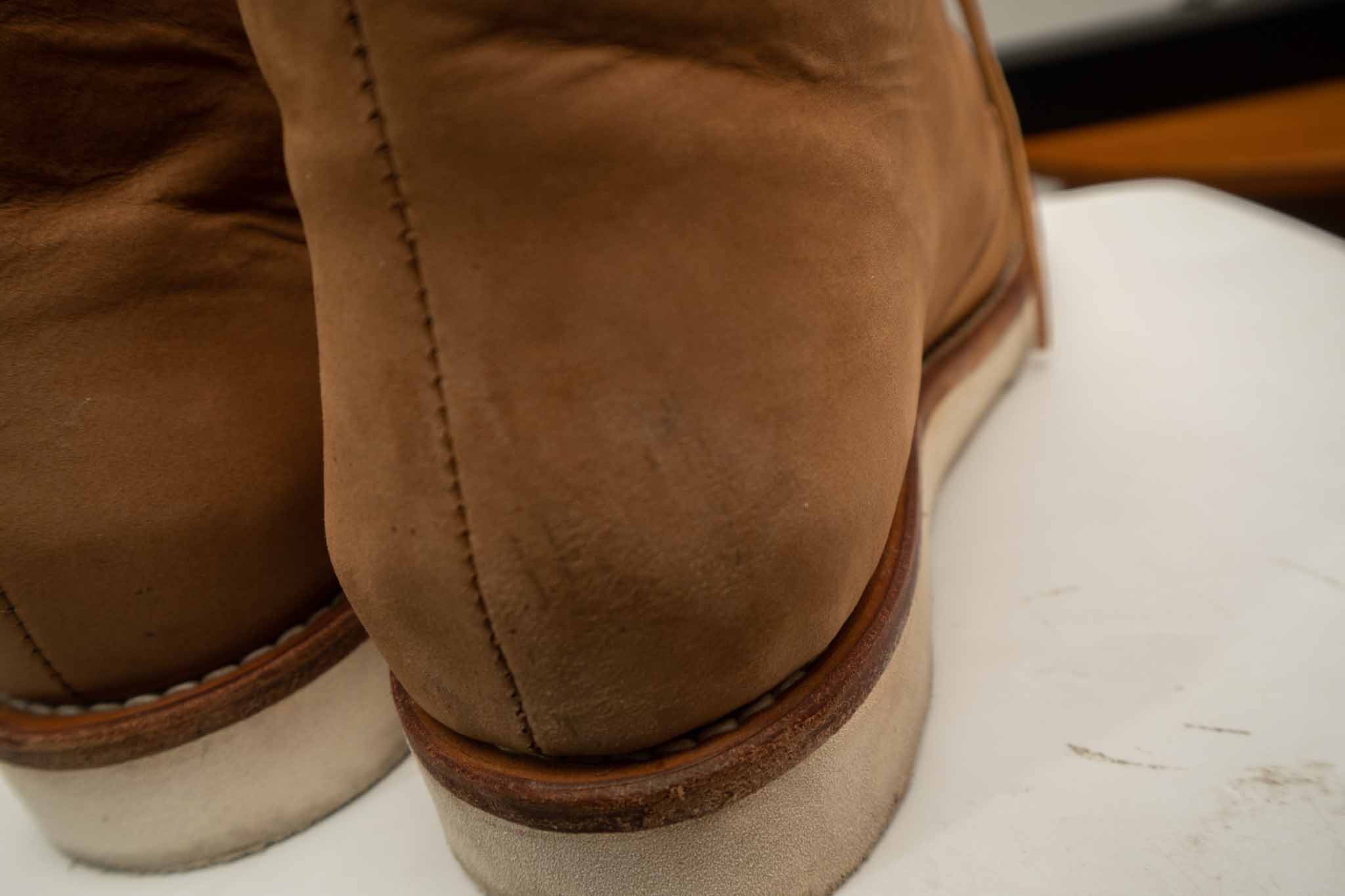 showing scratch marks on leather boot
