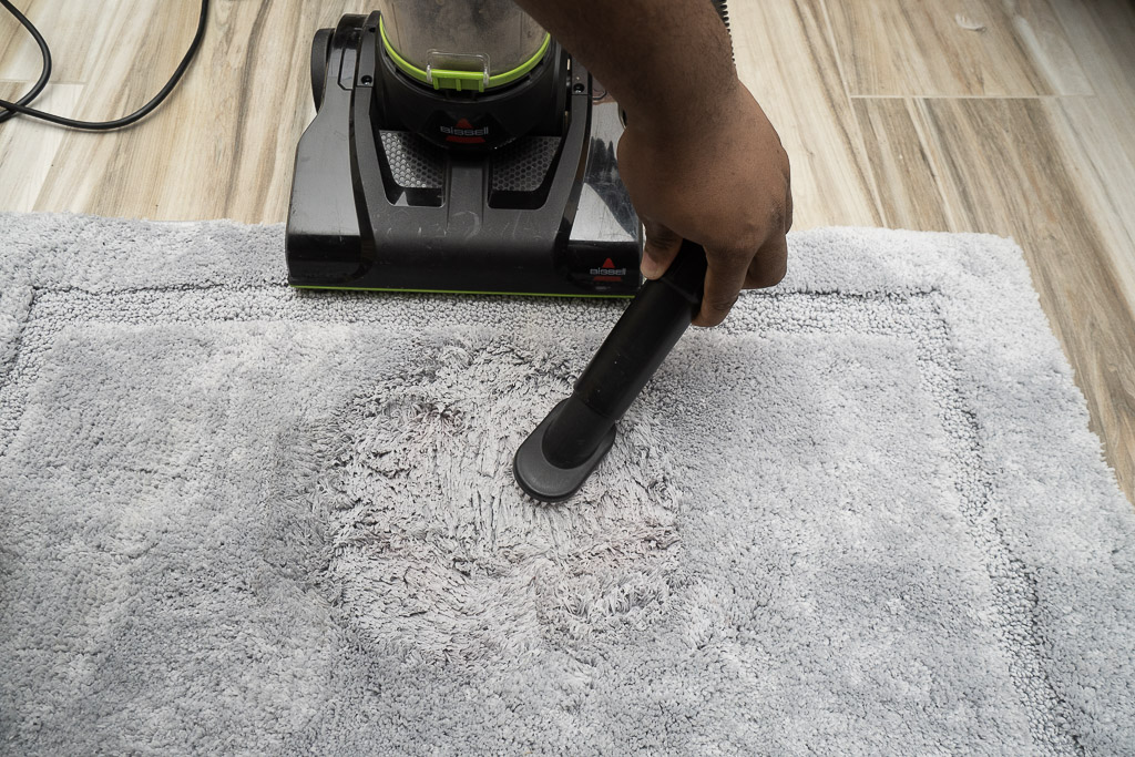 using vacuum to clean carpet