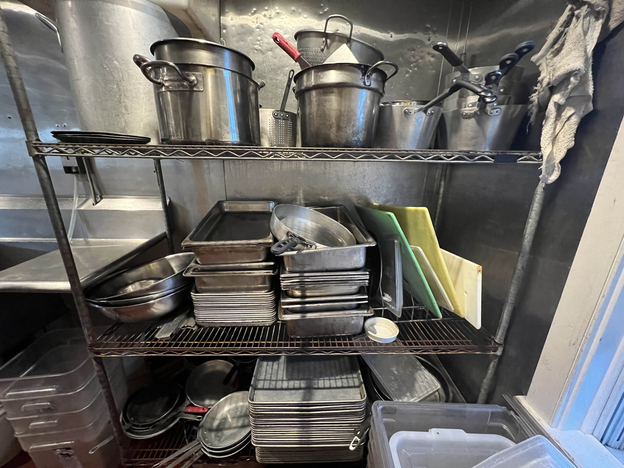 metal shelves with pots and pans