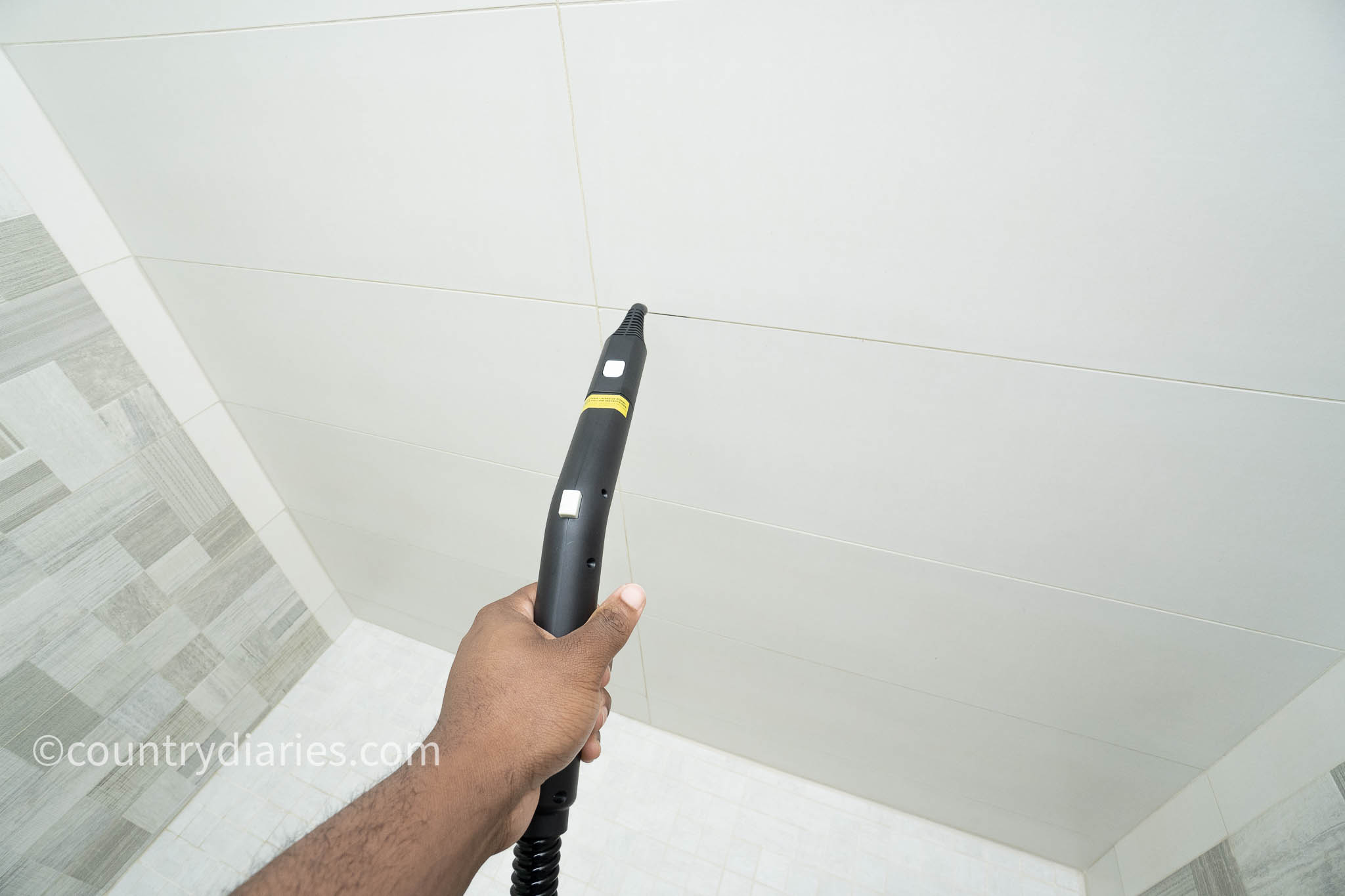 steaming grout joint to soften grout