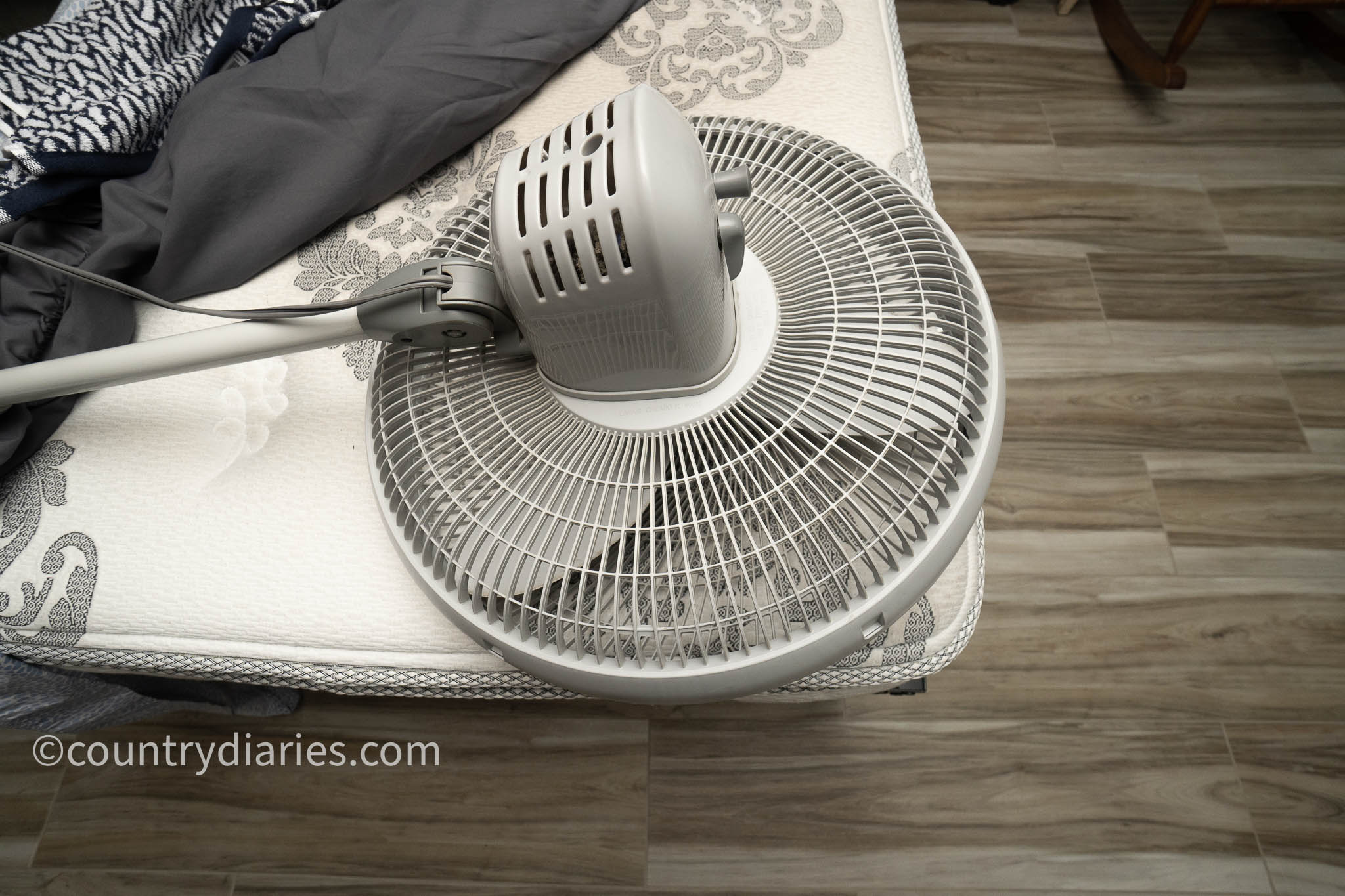 using standing fan to dry mattress