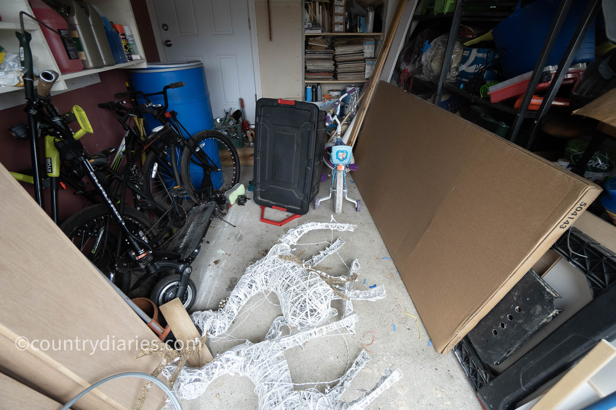 bins, bicycles and other things on garage floor