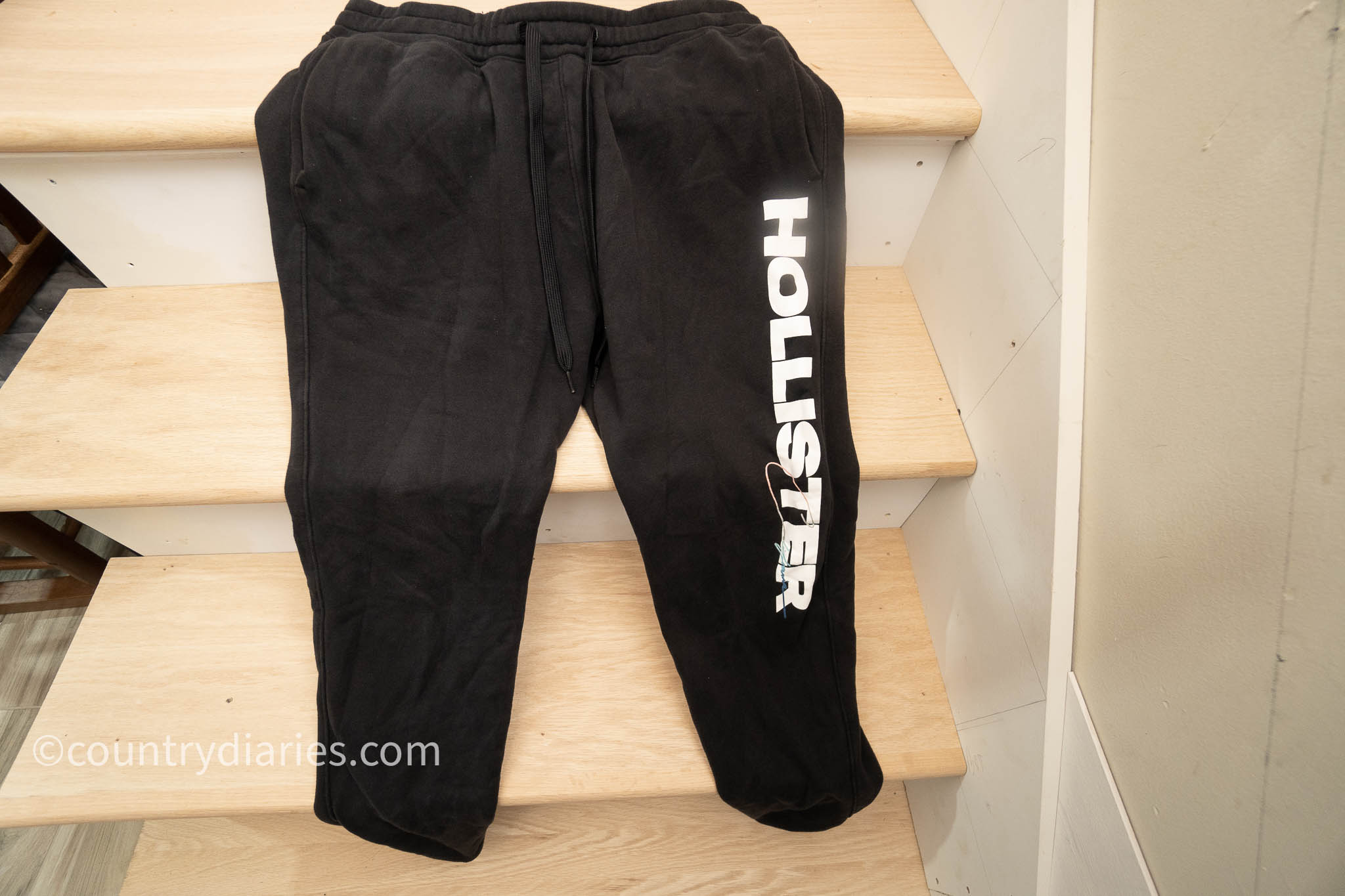Hollister sweatpants on staircase
